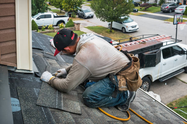 Professional Roof Replacement technician working in Concord, MA